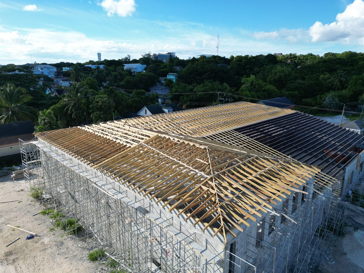 John's Department Store at 6th Terrace with roof trusses going on, September 2026