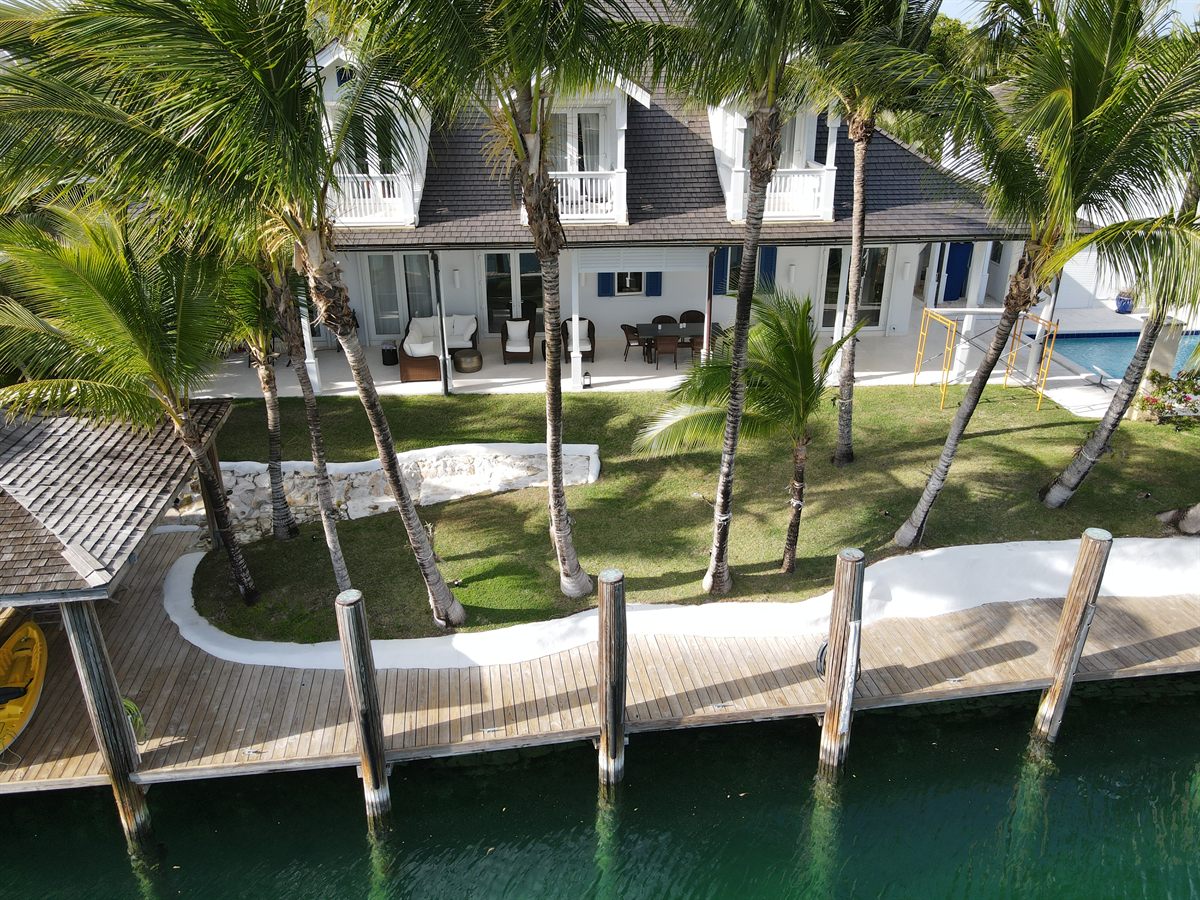 Old Fort Bay residence from the canal, new roof and dock
