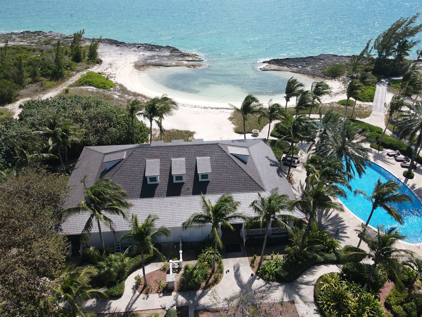 Royal Island main house re-roofed in Enviroshake, beach and dock behind, March 2026