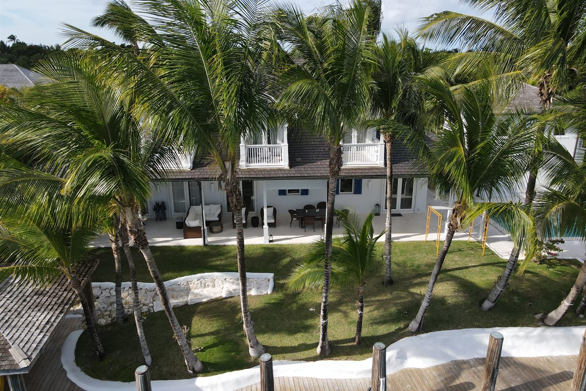 Two-storey canal-front home at Old Fort Bay after roof replacement